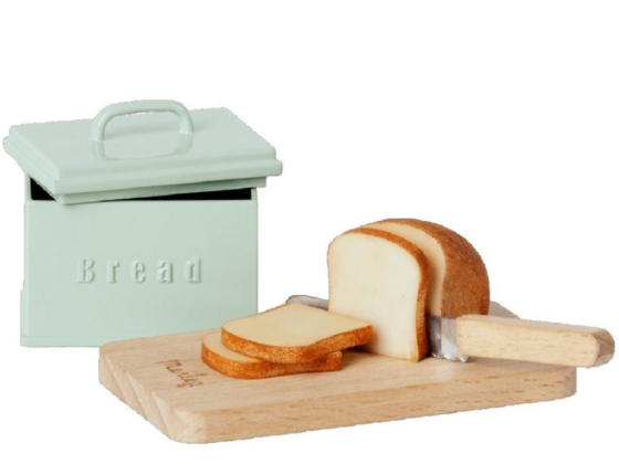 Brødboks i metall, brød og kniv