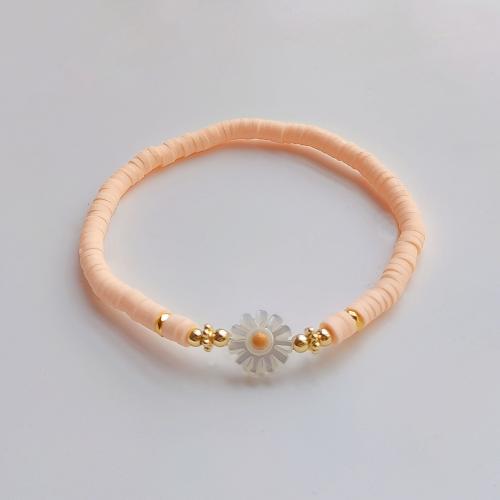 Armbånd med strikk. Blomst. Dus rosa